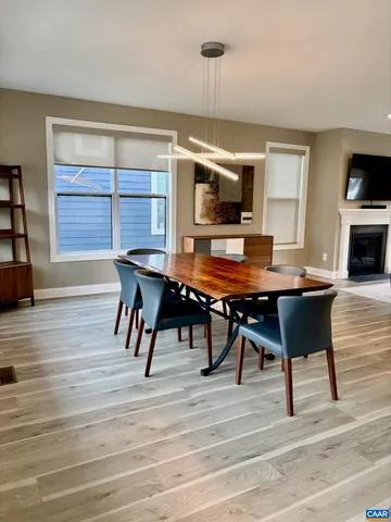 a workspace with furniture window and wooden floor