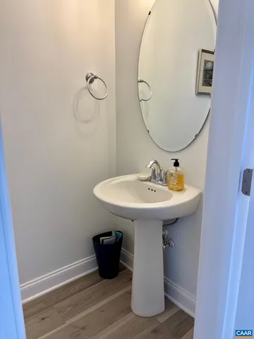 a bathroom with a sink and mirror