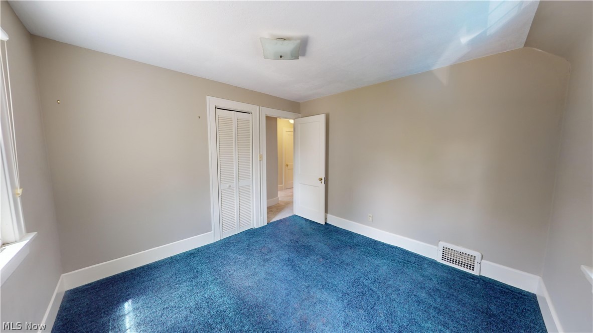 3988 Navahoe Road Cleveland Heights, OH 44121 - Photo 21 of 31 Unfurnished bedroom with a closet and carpet flooring