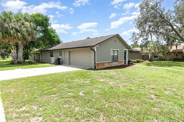 a house view with swimming pool in front of it