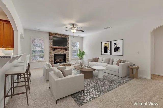 a view of empty room with a fireplace