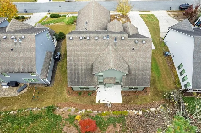 an aerial view of residential houses with outdoor space