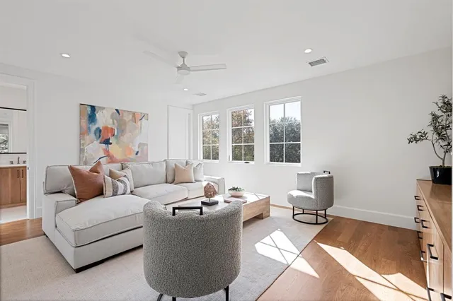 a living room with furniture rug and window
