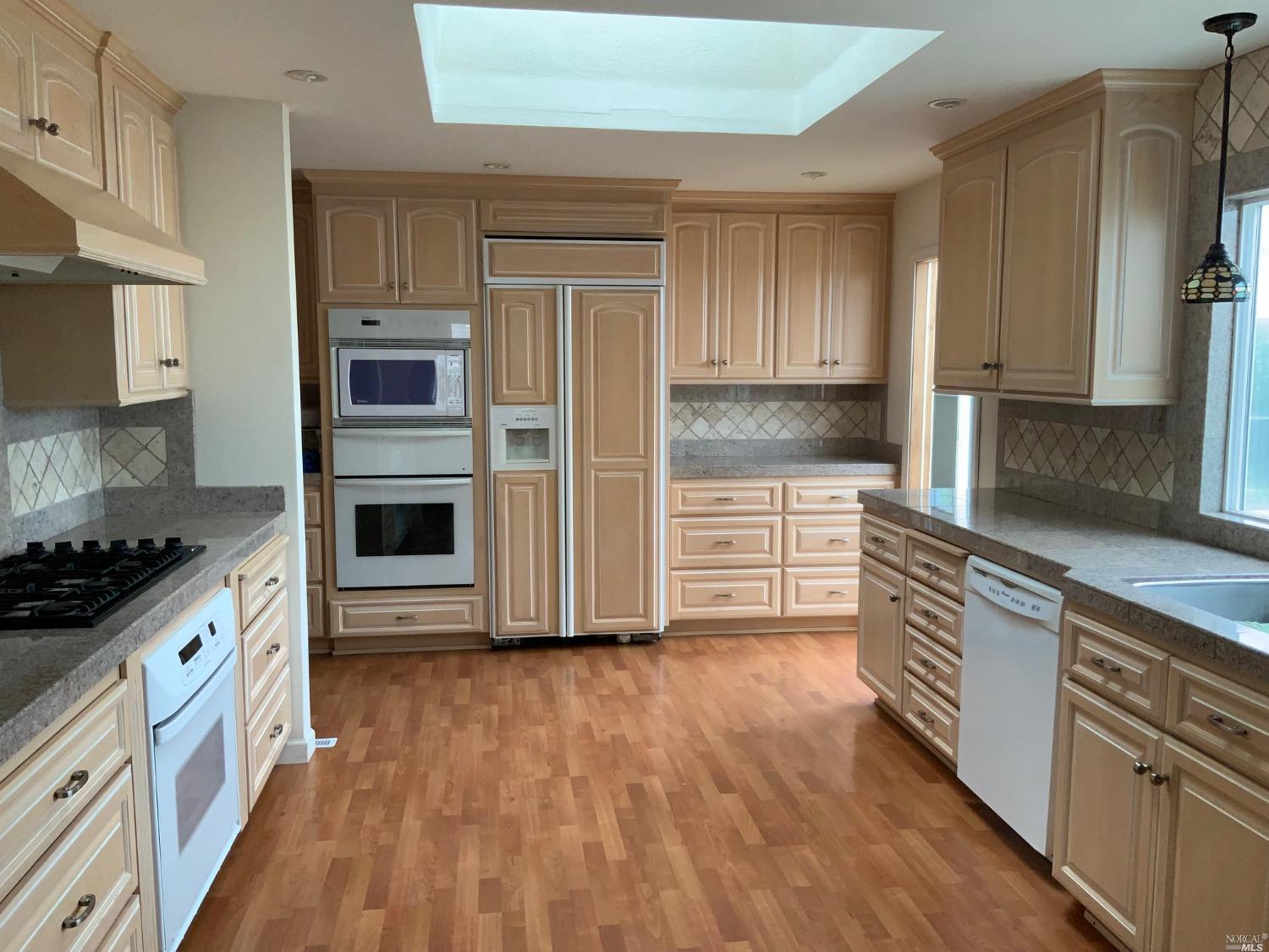 478 Piezzi Lane Santa Rosa, CA 95401 - Photo 1 of 1 a kitchen with stainless steel appliances a stove a sink and a refrigerator