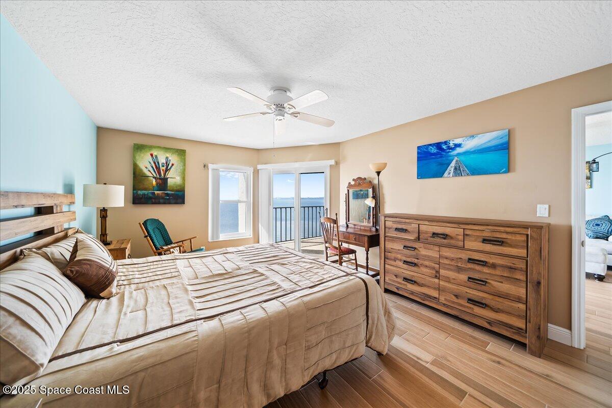 3220 River Villa Way, Unit 151 Melbourne Beach, FL 32951 - Photo 12 of 51 a bedroom with a bed and a dresser