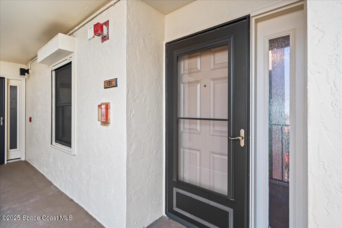 3220 River Villa Way, Unit 151 Melbourne Beach, FL 32951 - Photo 36 of 51 a view of a hallway with elevator