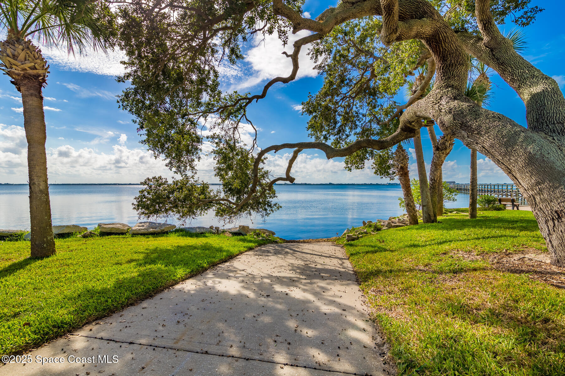 3220 River Villa Way, Unit 151 Melbourne Beach, FL 32951 - Photo 41 of 51 a backyard of a house with lots of green space
