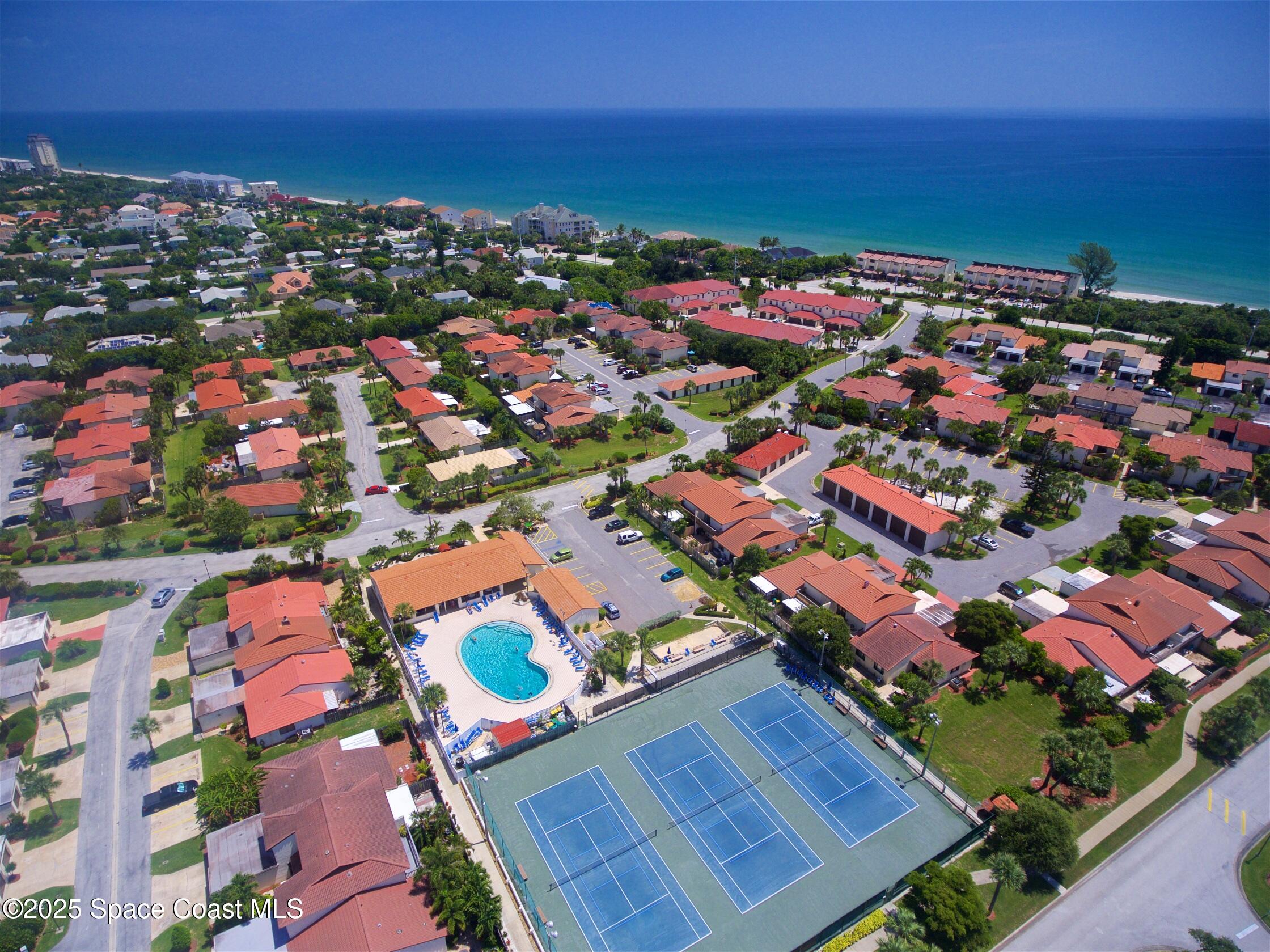 3220 River Villa Way, Unit 151 Melbourne Beach, FL 32951 - Photo 45 of 51 an aerial view of residential houses with outdoor space