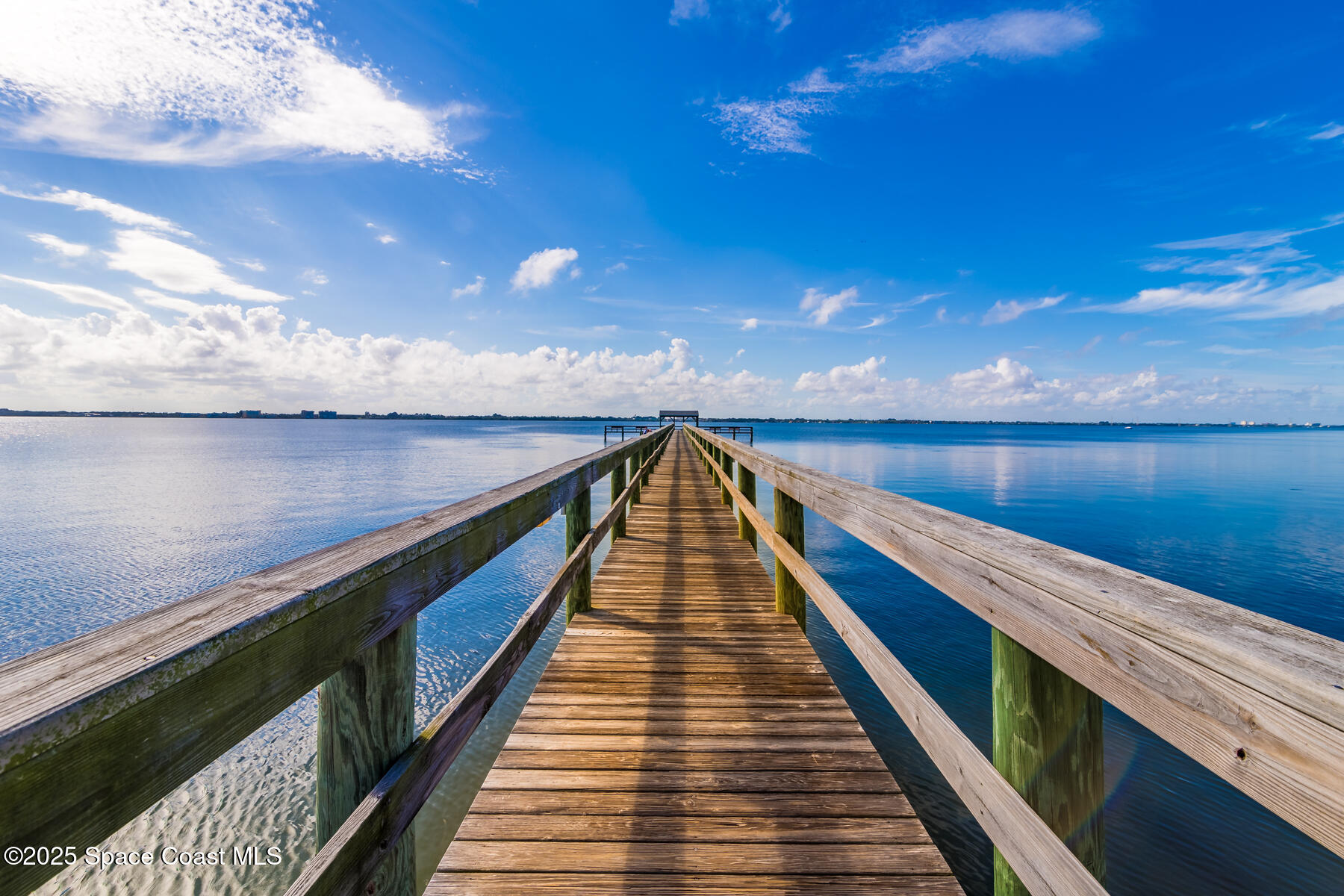 3220 River Villa Way, Unit 151 Melbourne Beach, FL 32951 - Photo 49 of 51 a view of wooden floor with a lake