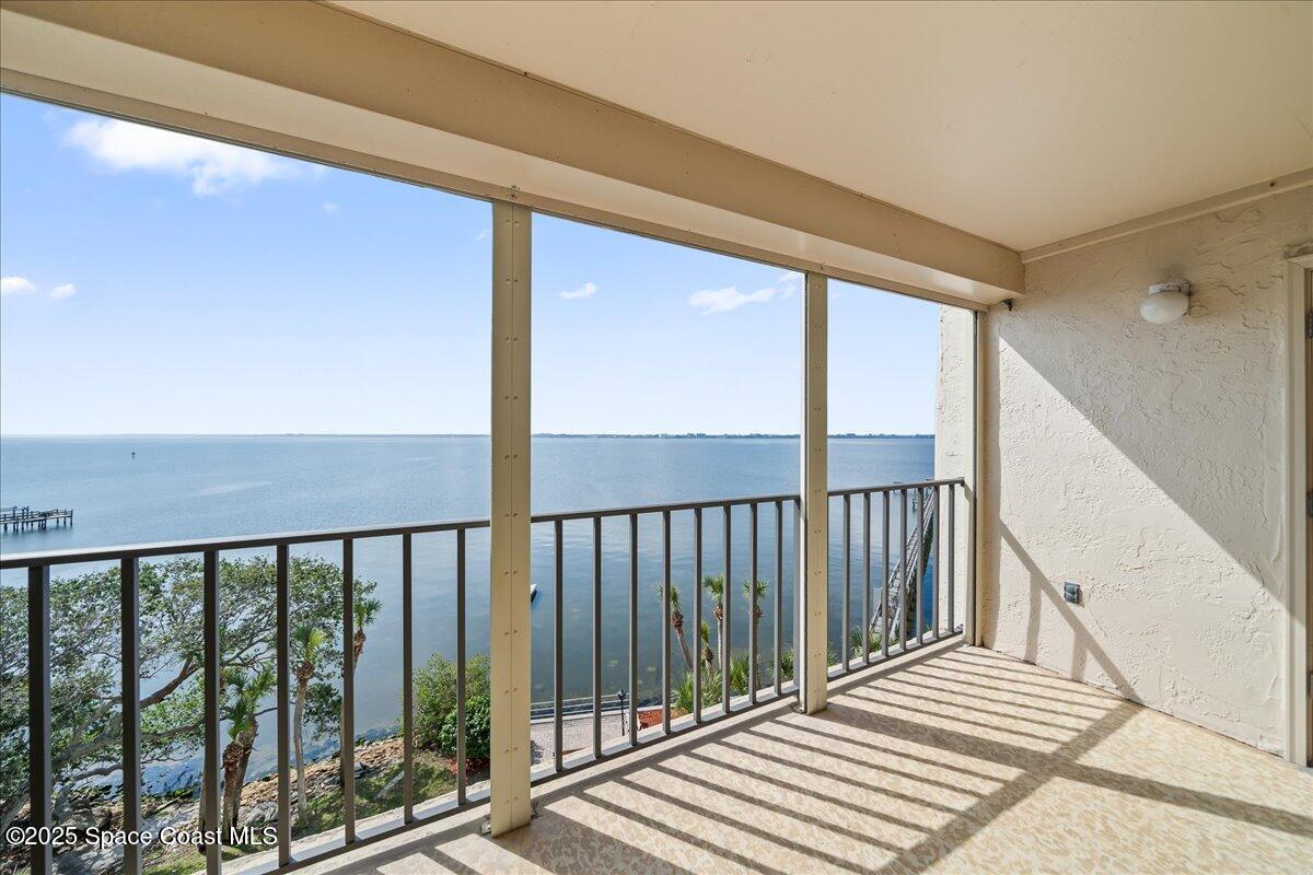 3220 River Villa Way, Unit 151 Melbourne Beach, FL 32951 - Photo 6 of 51 a view of a balcony with wooden floor