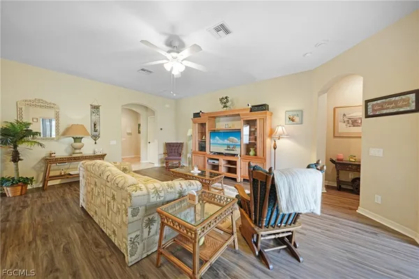 a view of a livingroom with furniture and a kitchen