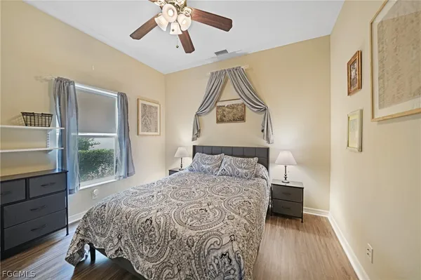 a bedroom with a bed and a table