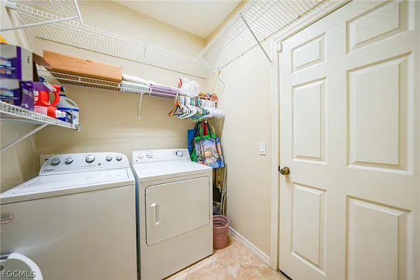 a view of a patio with table and chairs a barbeque with wooden floor and fence