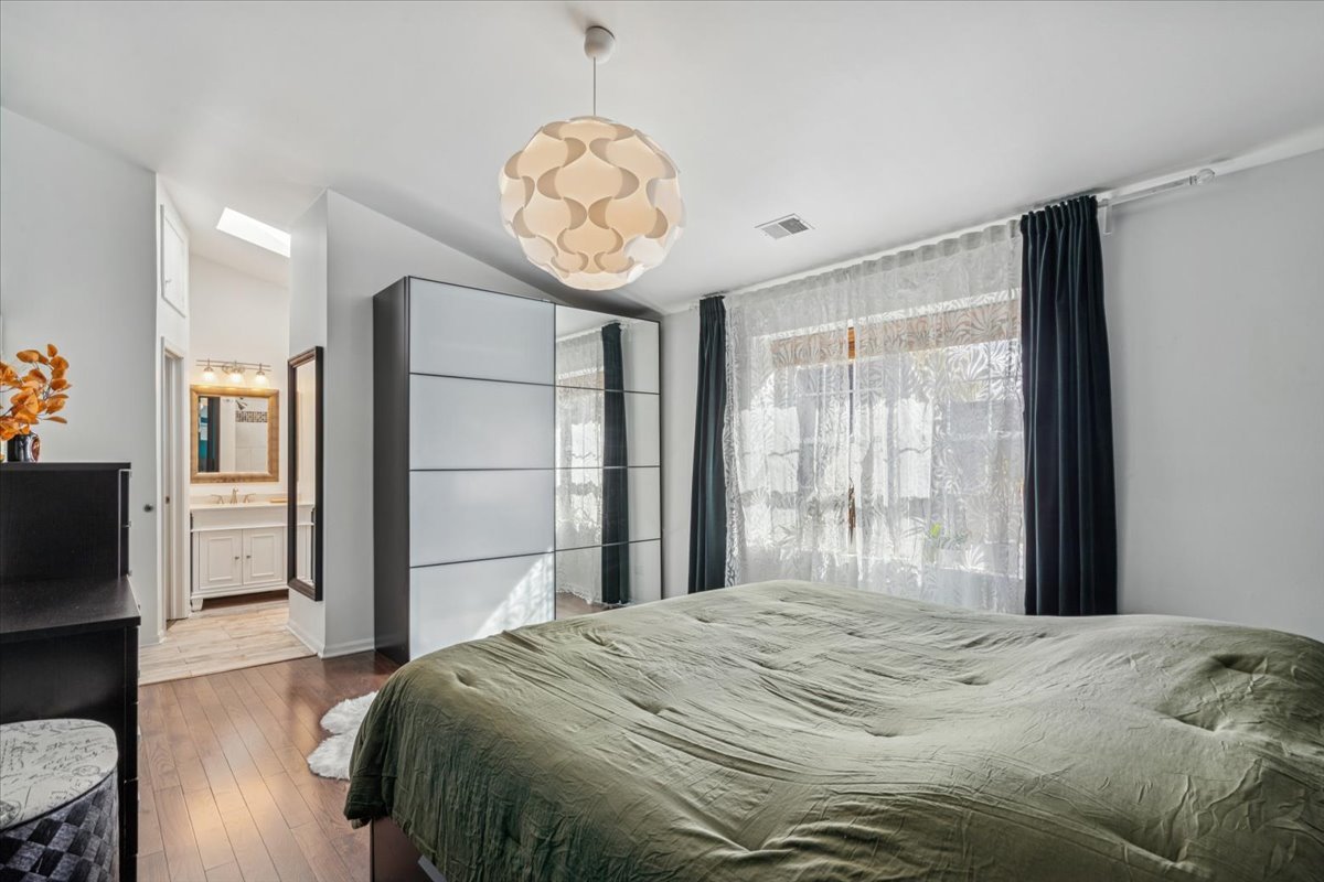 1321 Longacre Lane Wheeling, IL 60090 - Photo 11 of 23 a bedroom with a bed and wooden floor