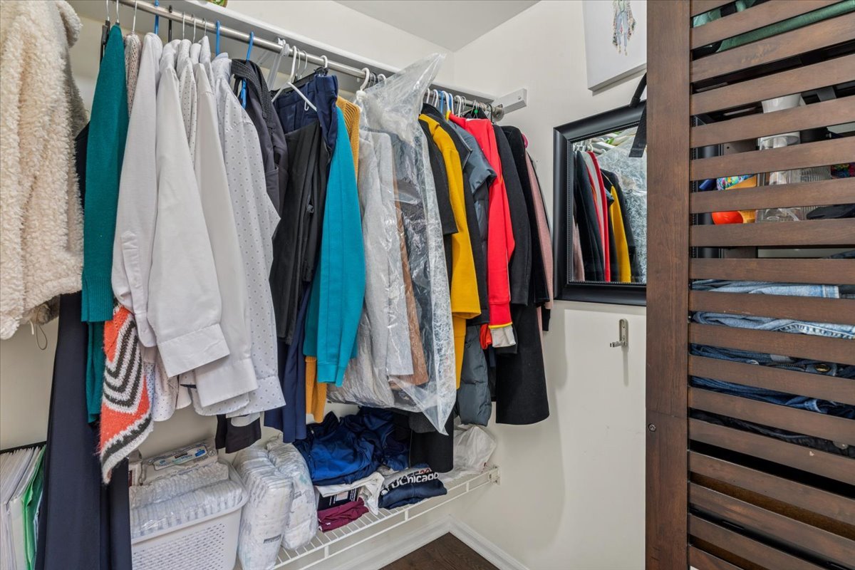 1321 Longacre Lane Wheeling, IL 60090 - Photo 15 of 23 a view of walk in closet with clothes and shoes