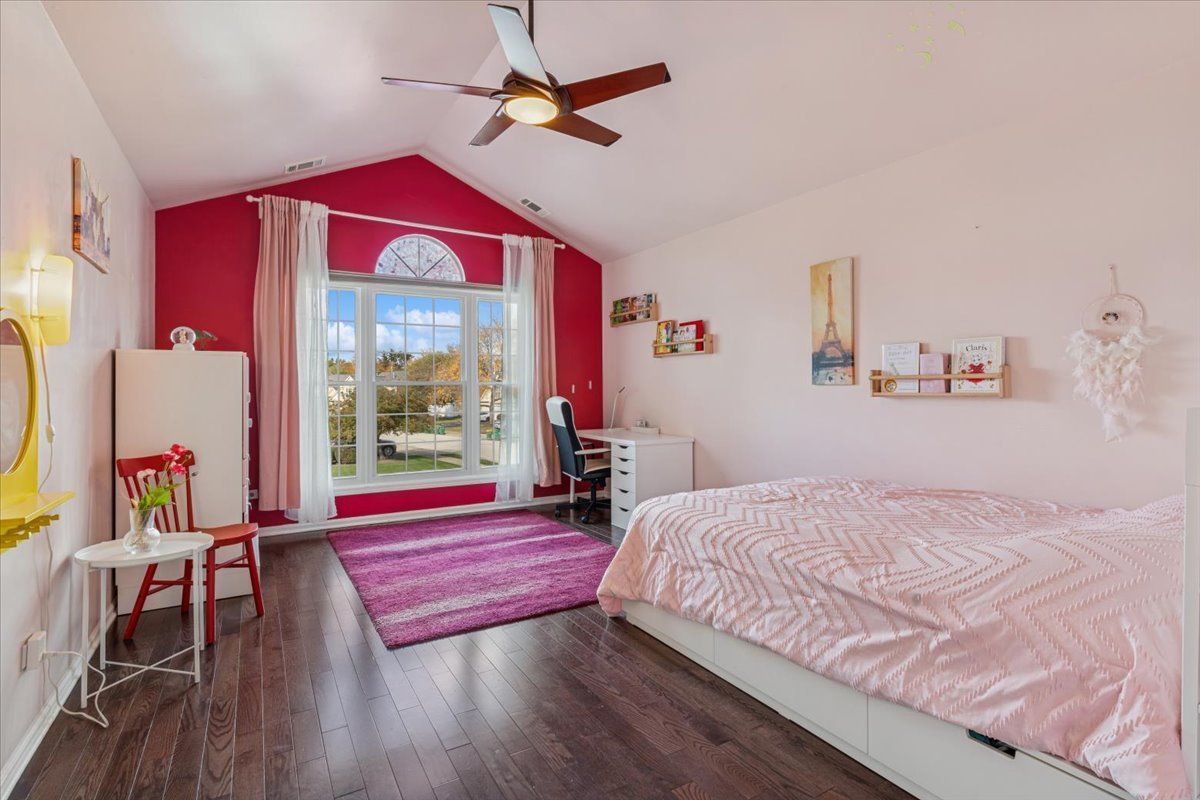 1321 Longacre Lane Wheeling, IL 60090 - Photo 17 of 23 a bedroom with a bed and wooden floor