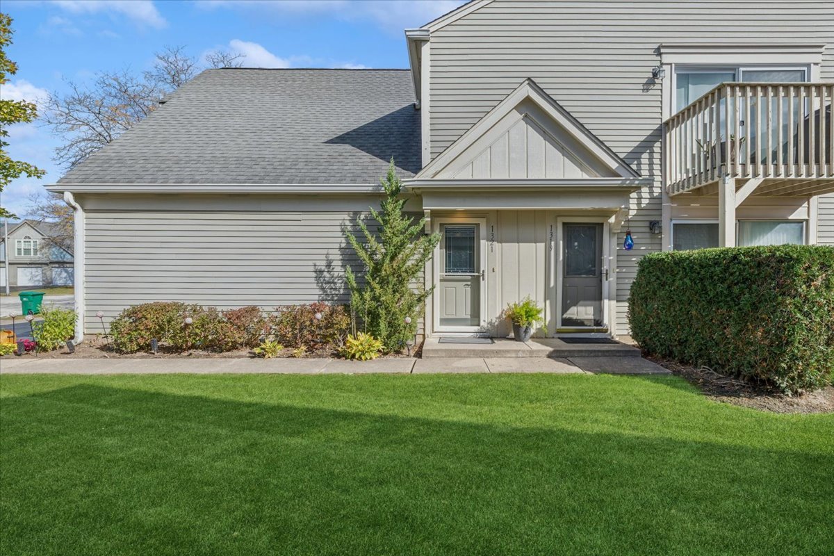1321 Longacre Lane Wheeling, IL 60090 - Photo 3 of 23 a view of a house with a yard and plants