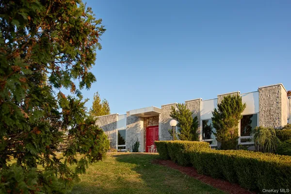 a view of a building with a yard