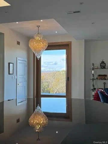 a vase of flowers sitting on a table in a room