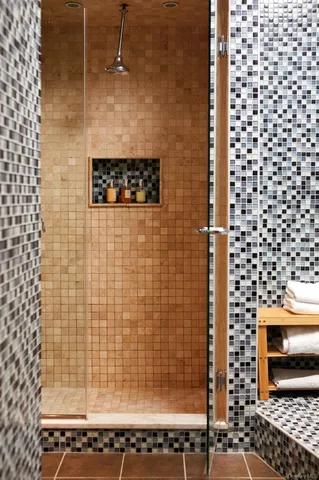 a bathroom with a shower and a sink