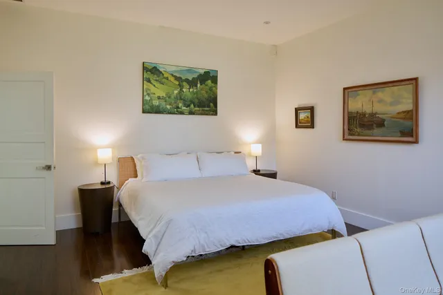 a bedroom with a bed and lamp