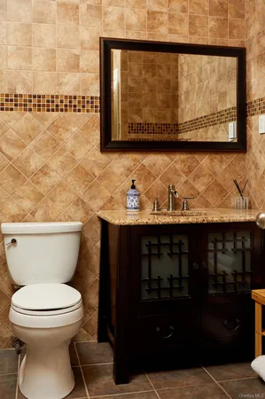 a bathroom with a toilet and a sink