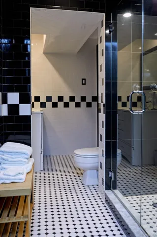 a bathroom with a toilet a sink and a shower