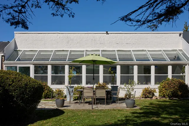 a backyard of a house with yard fire pit and outdoor seating