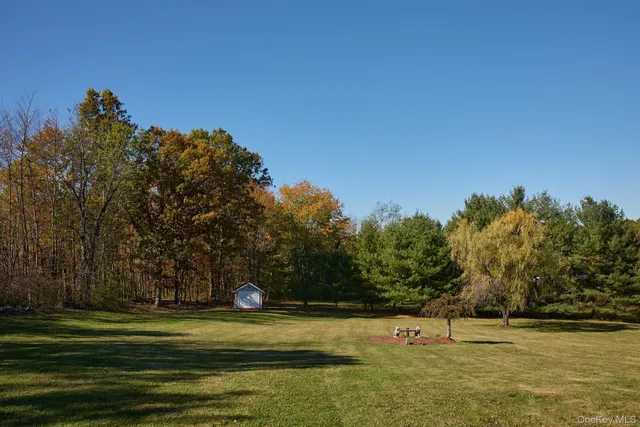a view of a swimming pool with an outdoor space and seating area
