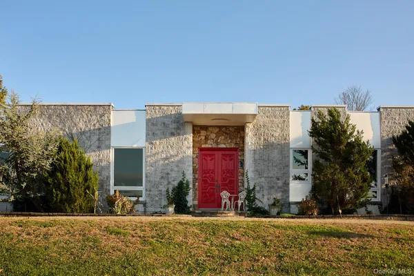 a view of a building with a yard