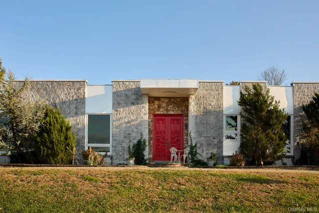 a view of a building with a yard