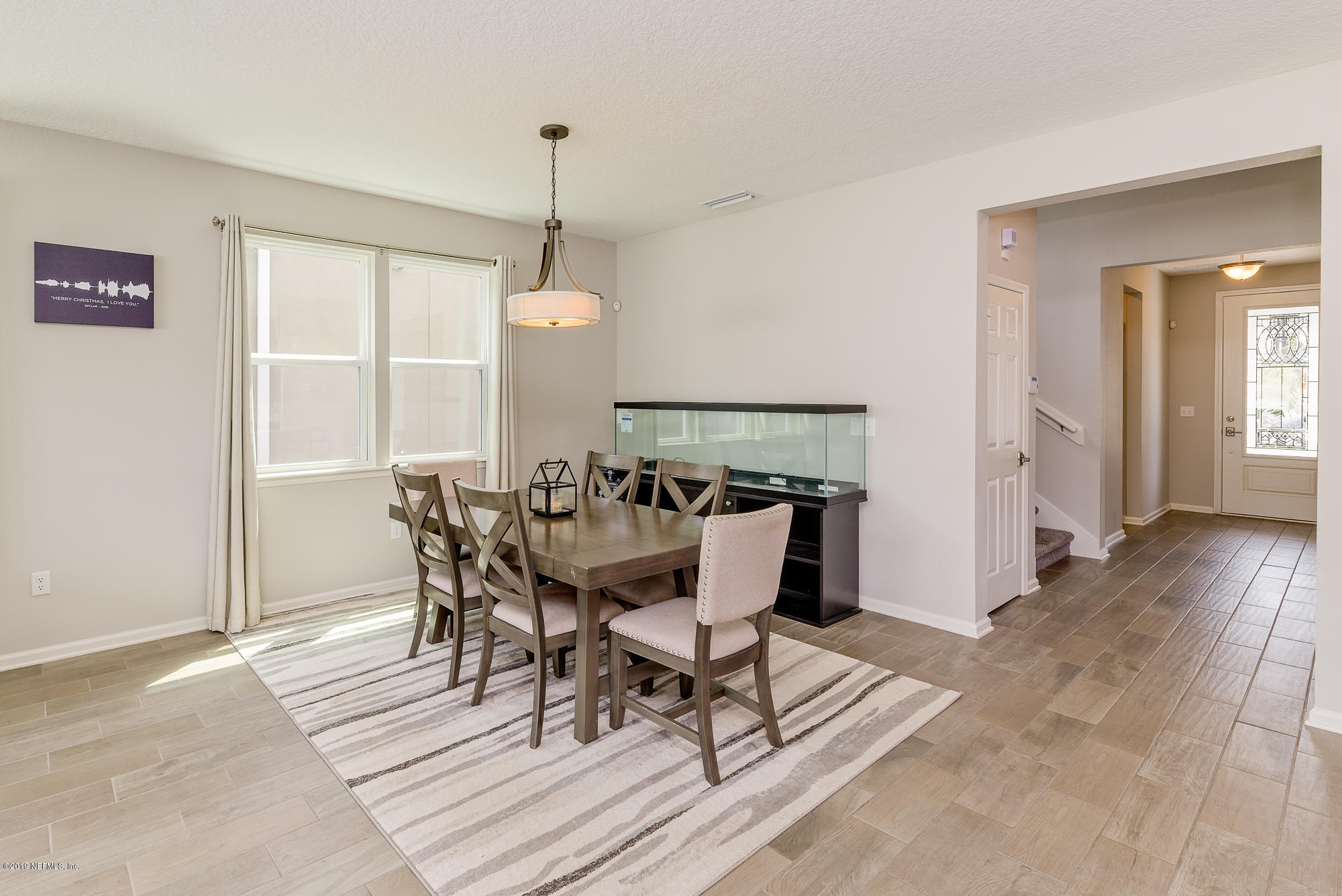 6739 Azalea Park Road Jacksonville, FL 32259 - Photo 8 of 29 a view of a dining room with furniture and wooden floor