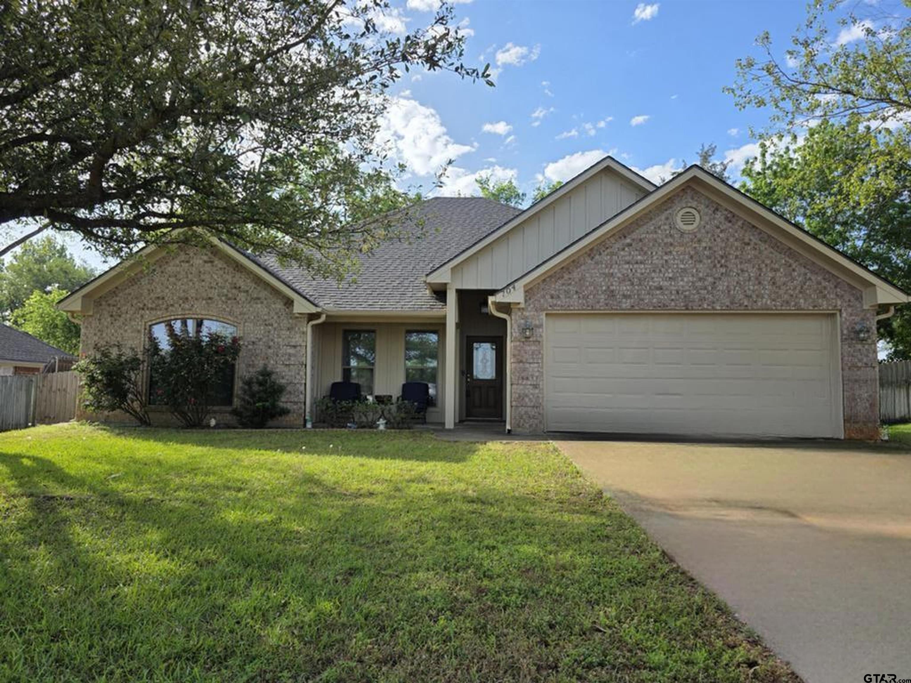 704 Windover Lane Bullard, TX 75757 - Photo 1 of 23 a front view of house with yard and trees in the background