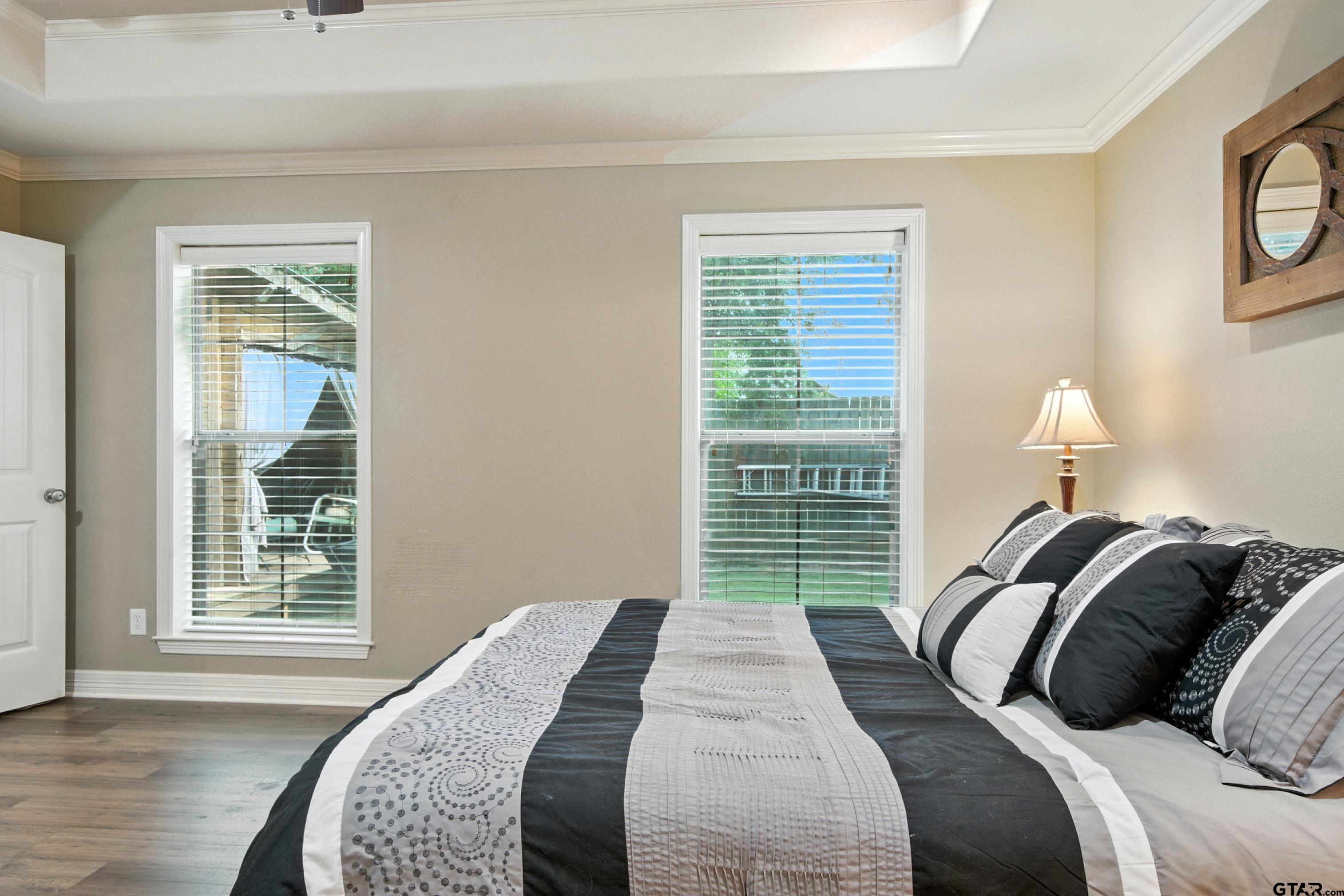 704 Windover Lane Bullard, TX 75757 - Photo 12 of 23 a bedroom with a bed and a large window