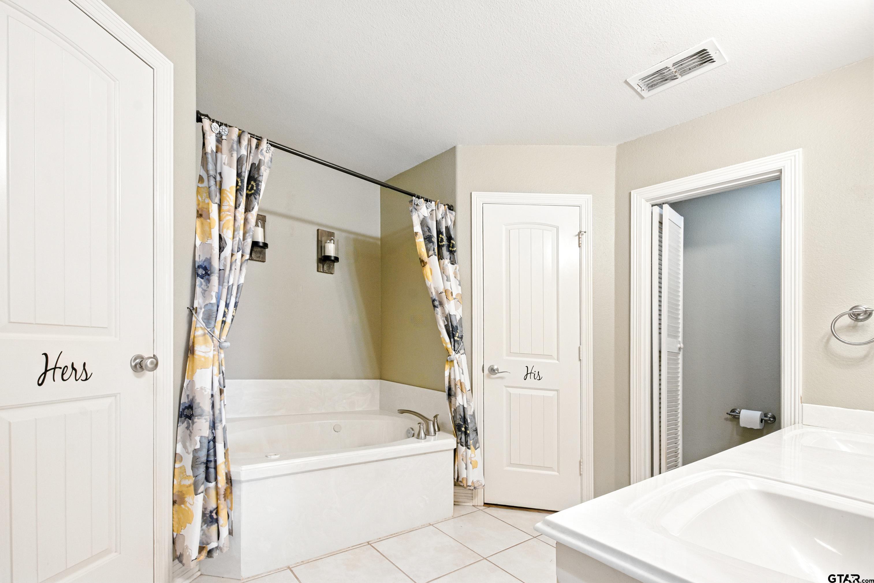 704 Windover Lane Bullard, TX 75757 - Photo 13 of 23 a bathroom with a bathtub and a shower