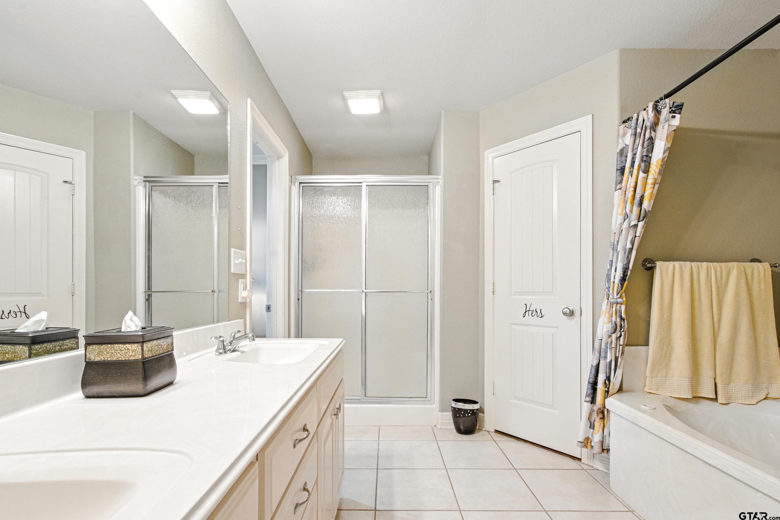 704 Windover Lane Bullard, TX 75757 - Photo 14 of 23 a bathroom with a sink and a mirror