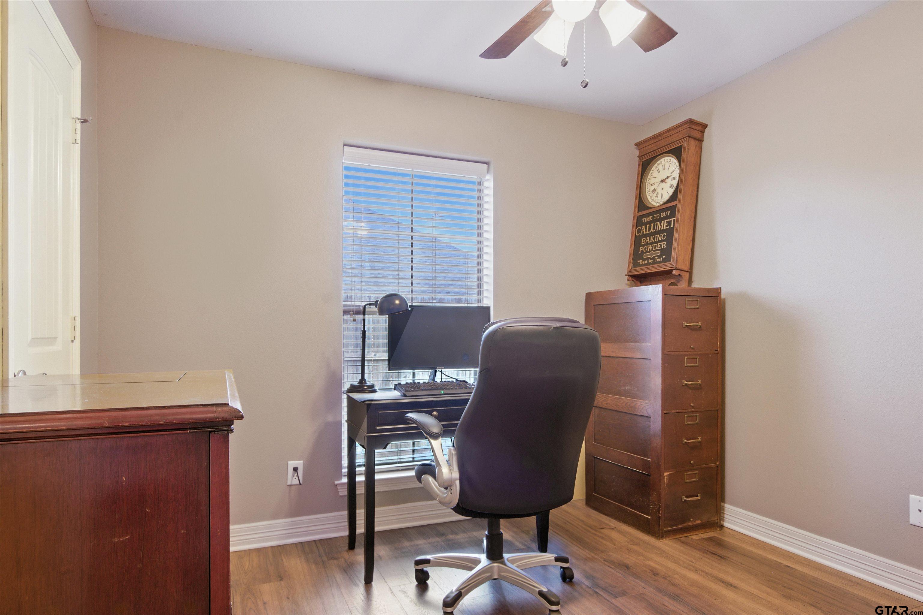 704 Windover Lane Bullard, TX 75757 - Photo 18 of 23 a view of a workspace with furniture and a window