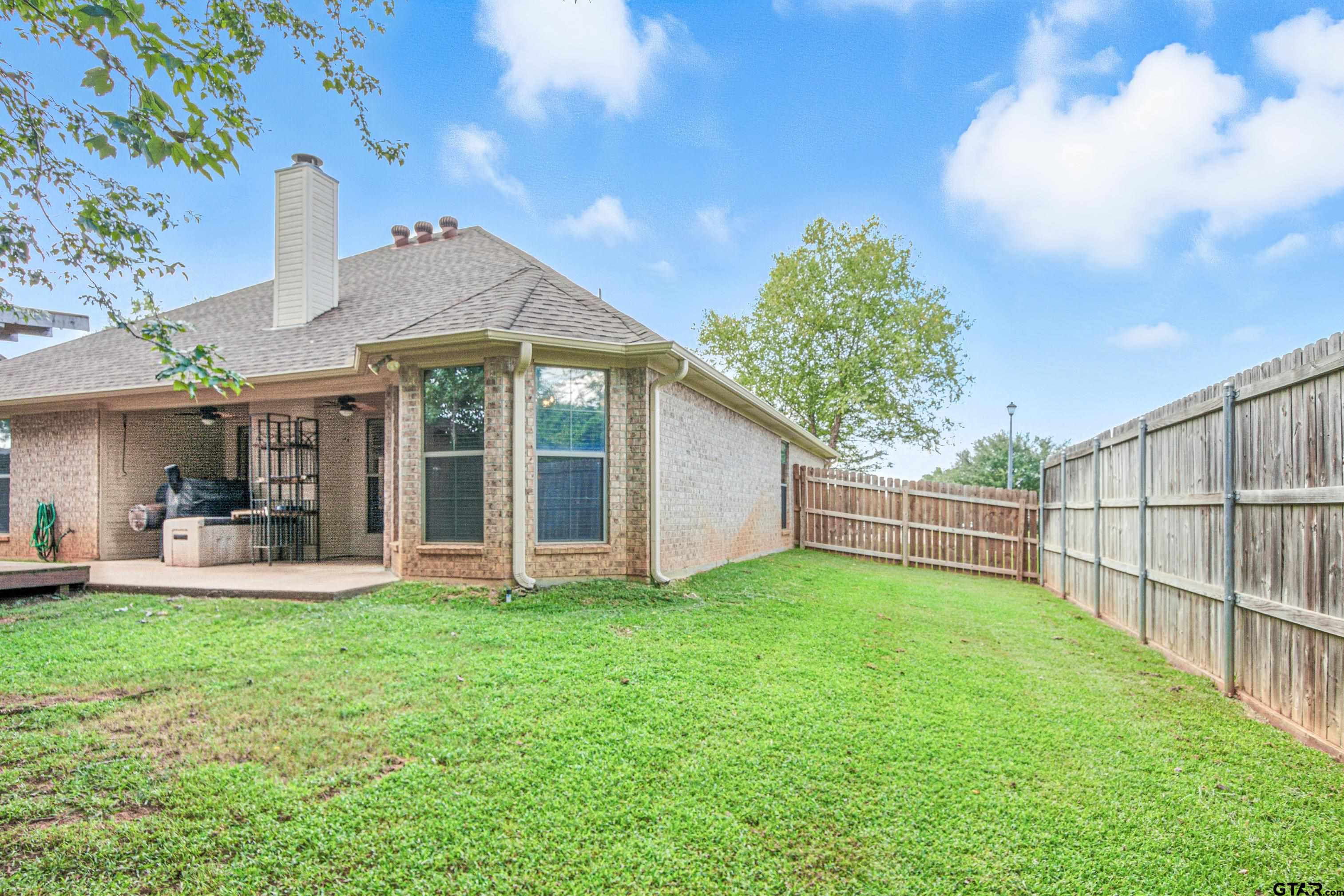 704 Windover Lane Bullard, TX 75757 - Photo 20 of 23 a view of a house with backyard and porch