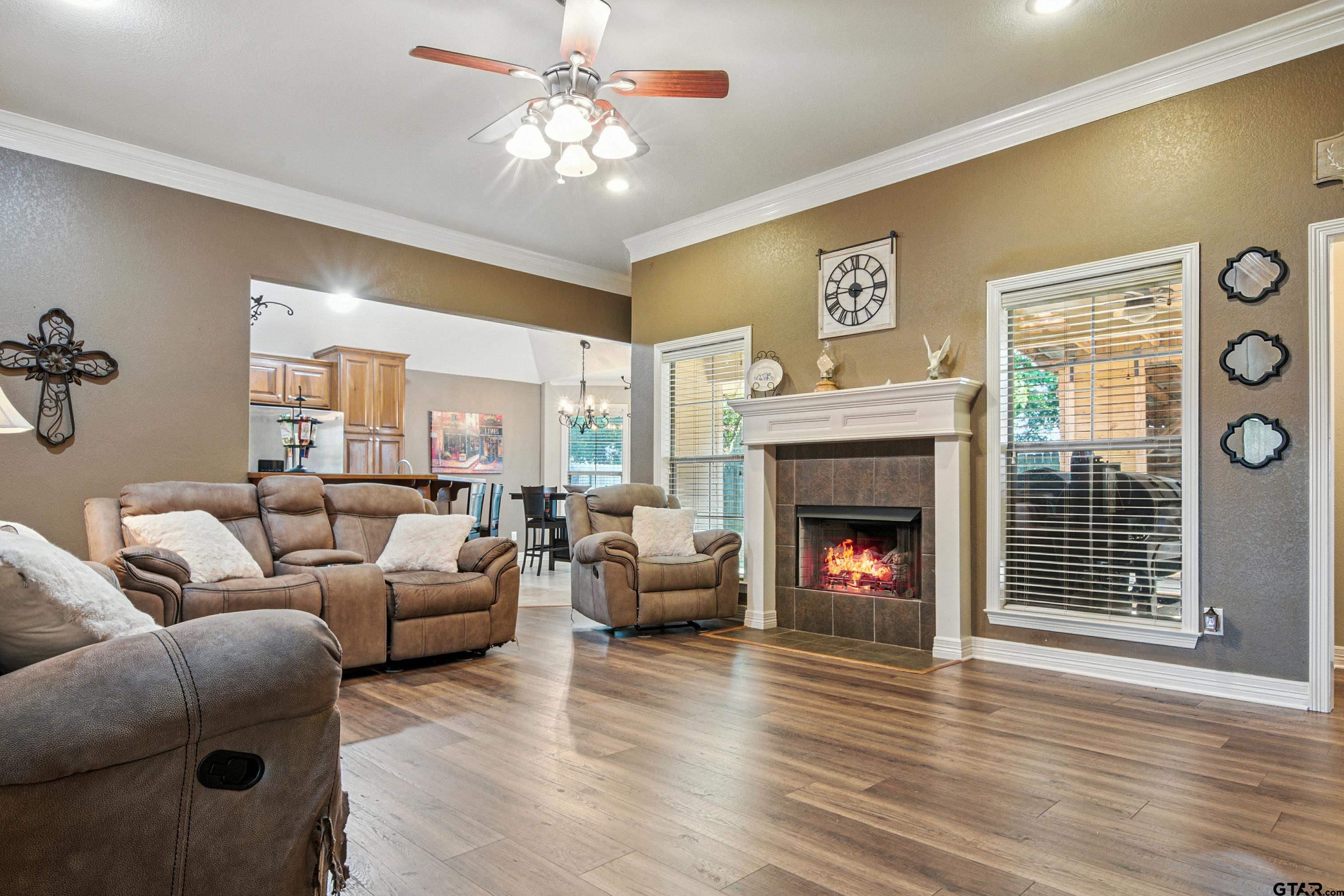 704 Windover Lane Bullard, TX 75757 - Photo 6 of 23 a living room with furniture and a fireplace