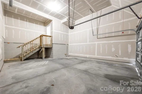 a view of a hallway with staircase