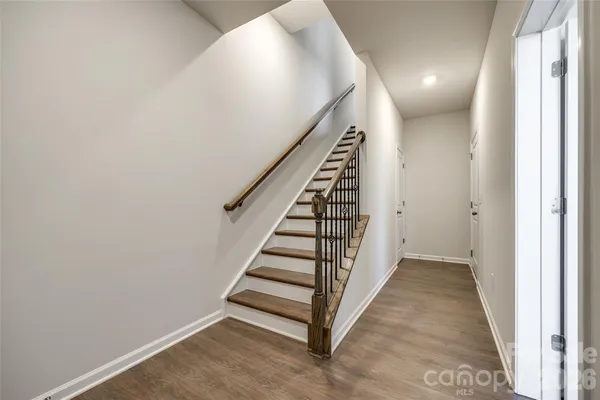 a view of a hallway with stairs