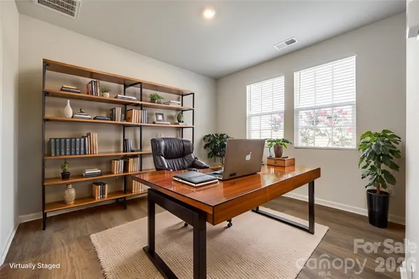 a workspace with furniture and a potted plant