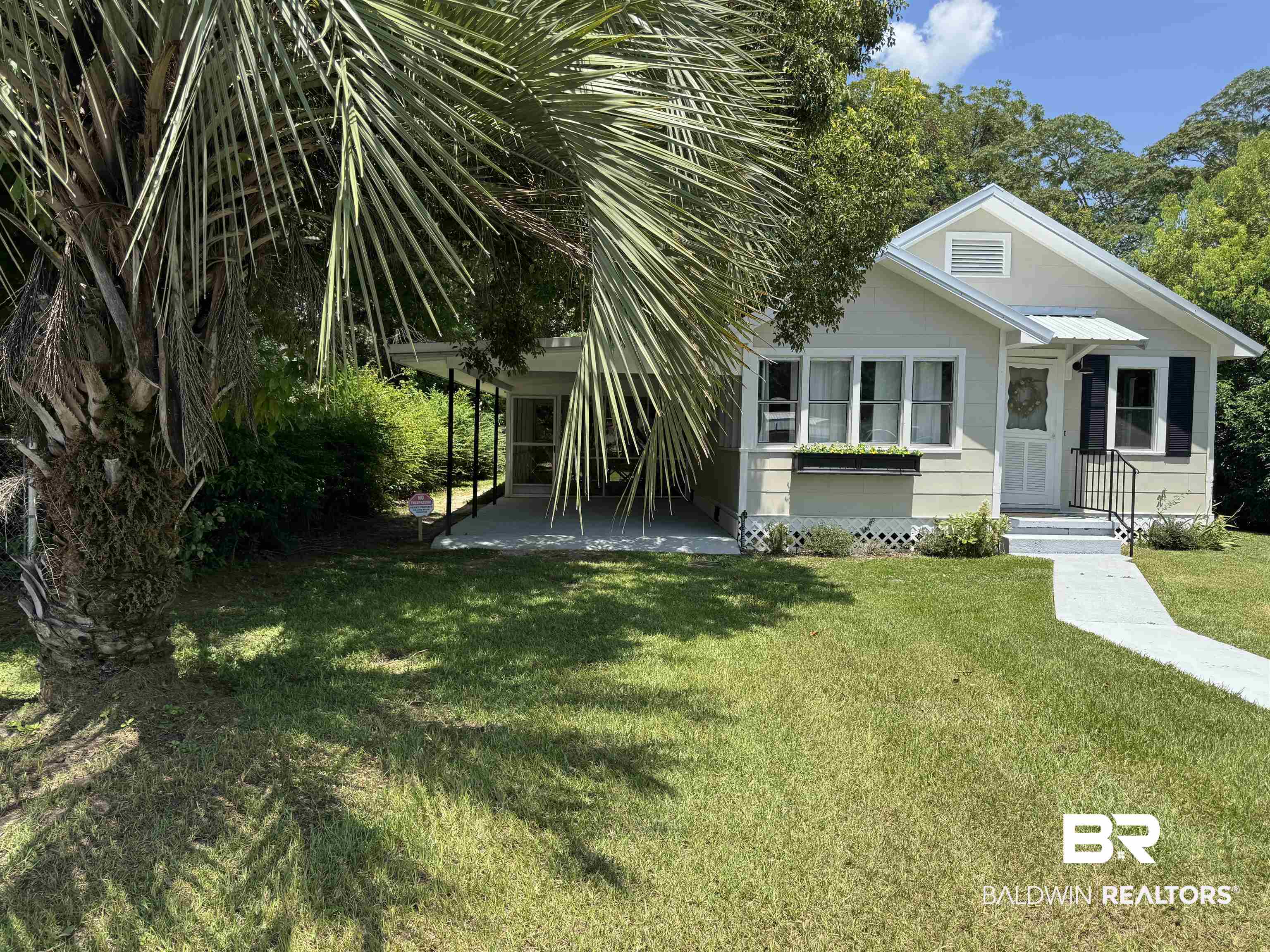22640 Racine Street Robertsdale, AL 36567 - Photo 1 of 40 View of front of home with a front yard