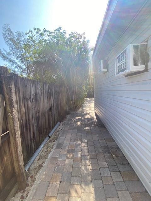 10666 South 228th Lane Boca Raton, FL 33428 - Photo 3 of 12 a view of a backyard with pathway