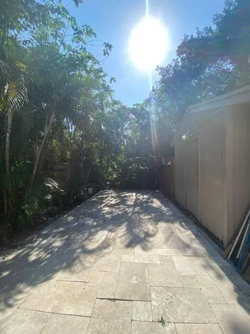 a view of a backyard of the house