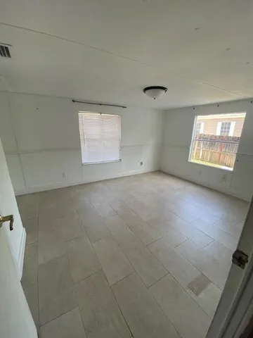a view of an empty room with a window