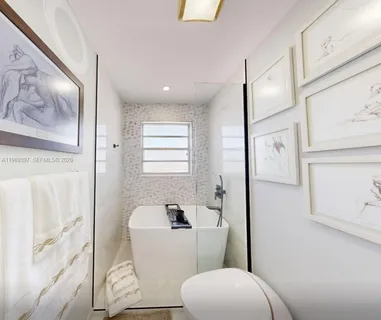a bathroom with a toilet sink and tub