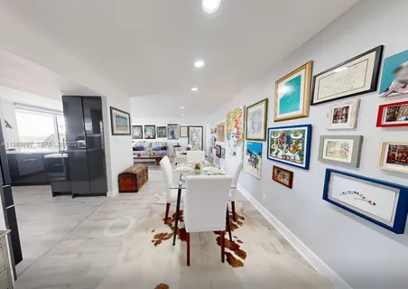 a view of a kitchen and dining room