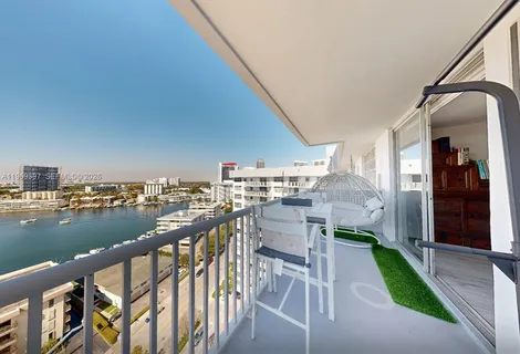 a view of a balcony with chairs