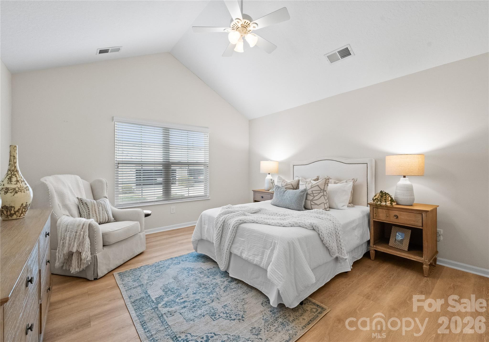 2304 Coltsview Lane Matthews, NC 28105 - Photo 14 of 36 a bedroom with a bed a couch and window